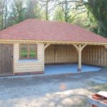 Completed 2 bay oak framed garage with workshop for storage.