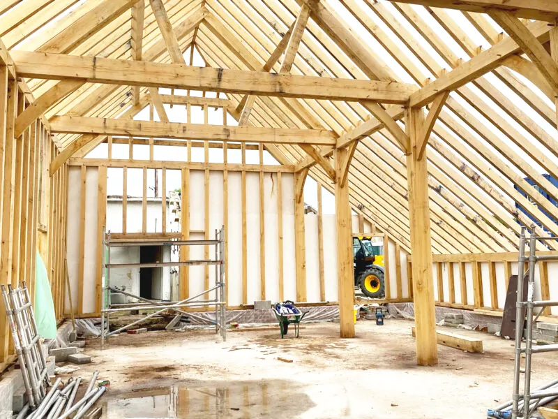 Interior of oak framed building under construction by oakcraft in guildford, surrey.