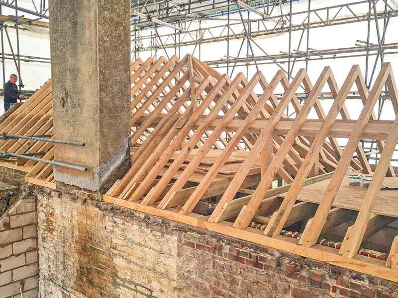 Oakcraft oak framed barn roof construction in progress at a farmm shop in guildford, surrey.