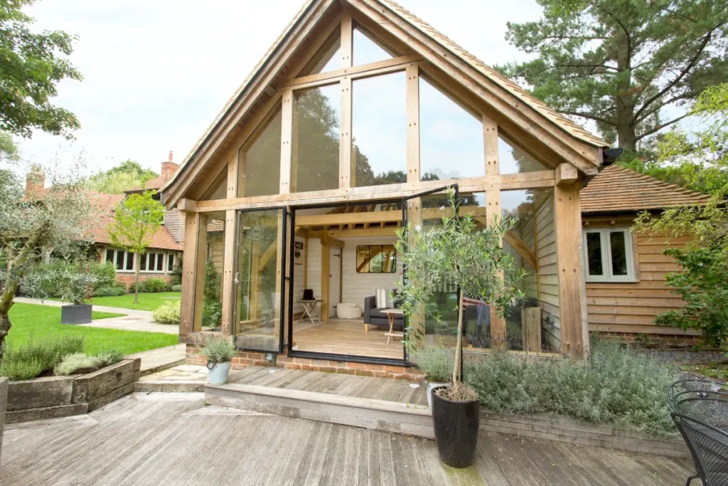 Bespoke oak-framed garden annexe by OakCraft, showcasing elegant design and natural light.