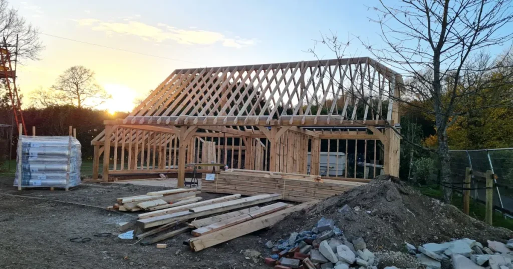 Bespoke oak frame garage in Salisbury, Wiltshire, under construction by OakCraft.