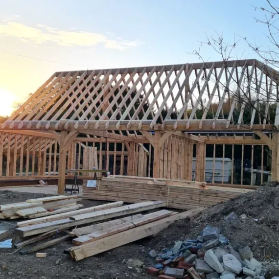 Bespoke oak frame garage in salisbury, wiltshire, under construction by oakcraft.