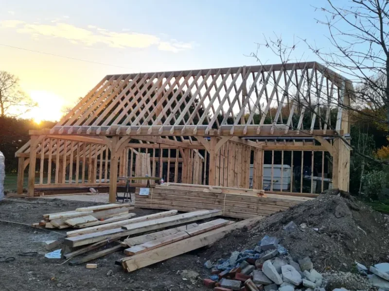 Bespoke oak frame garage in Salisbury, Wiltshire, under construction by OakCraft.