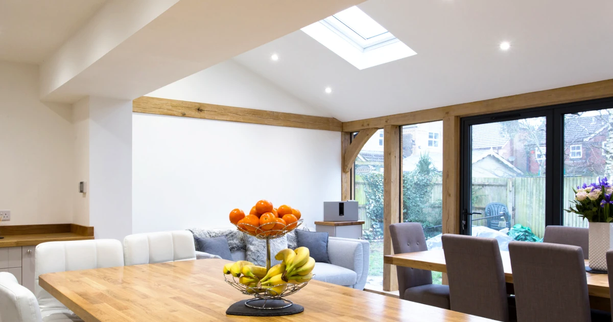 Oak framed extensions Berkshire: Kitchen extension with vaulted ceiling, exposed oak beams and modern open plan dining area