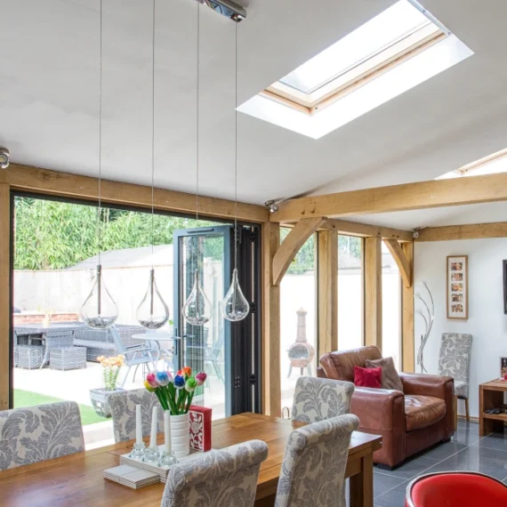 Modern oak extension for more living space,with dining and kitchen area, featuring skylights, bifold doors and open-plan layout