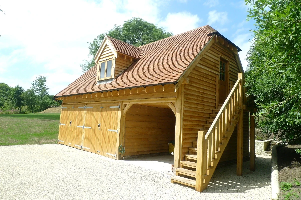 Large oak framed garage building with 3-bays for vehicles and storage