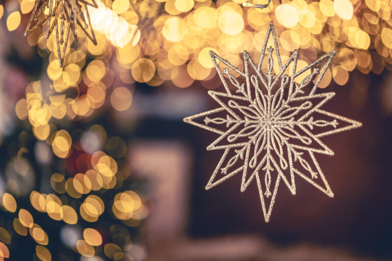 Christmas background with decorative star with bokeh lights.